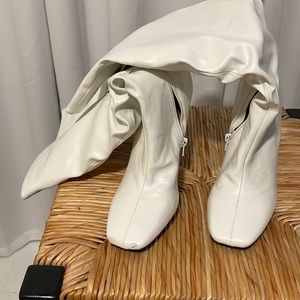 Beautiful white knee high boots.